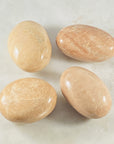 Peach Moonstone palm stone for energy healing, relaxation and serenity