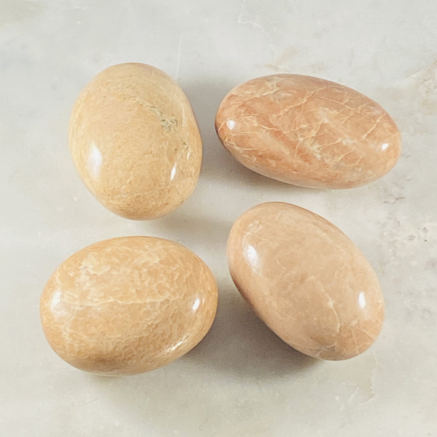 Peach Moonstone palm stone for energy healing, relaxation and serenity