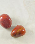 Red Jasper palm stone to empower the root chakra and for grounding energy.